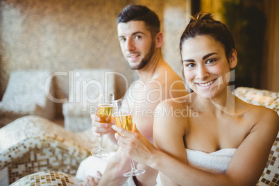 Happy couple celebrating with champagne