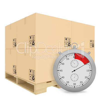 Paper covered boxes on wooden pallet with a stopwatch standing next