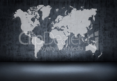 World map on old wall in a dark room