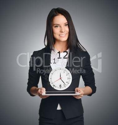 Business woman shows a clock. Flying digits symbolize leaving time