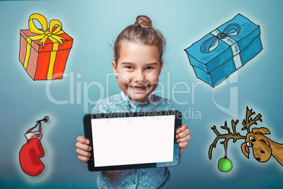 teen girl  holding a tablet New Year gifts around Christmas reindeer sketch mitten