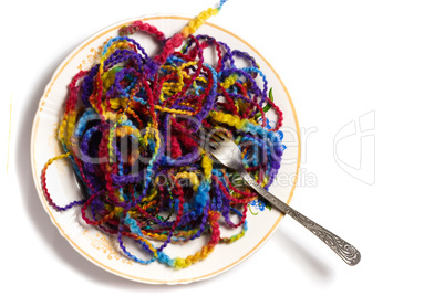 Full plate of melange yarn with a fork