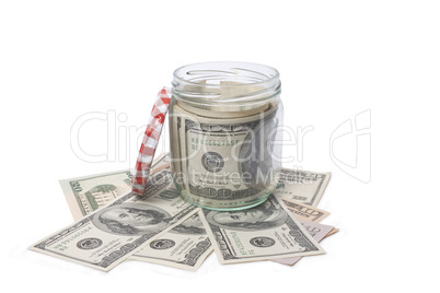 Dollar banknotes in a glass jar