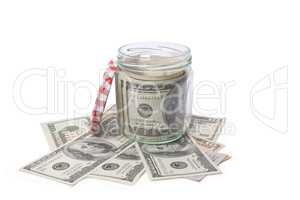 Dollar banknotes in a glass jar