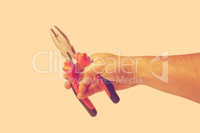 Hand with pliers