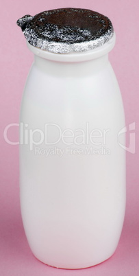 white bottle on pink background