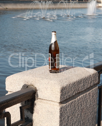 bottle on fence