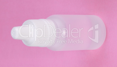White Plastic Vial on Pink Background