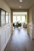 Home Entry Way with Wood Floors and Wainscoting