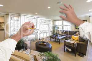 Male Hands Drawing Entertainment Center Over Photo of Home Inter