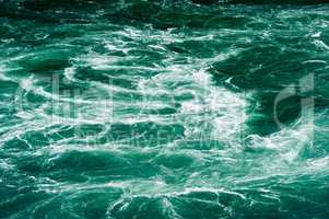 Abstract white water currents in green river