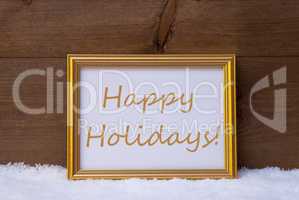 Golden Frame With Text Happy Holidays On Snow