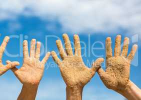 Woman and Man Shows his Open Hands Covered with Beach Sand