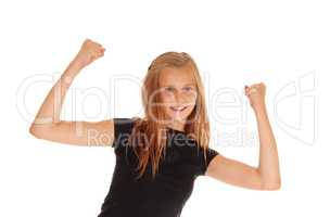 Happy young girl raising her arms.