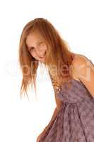 Smiling little girl bending down.