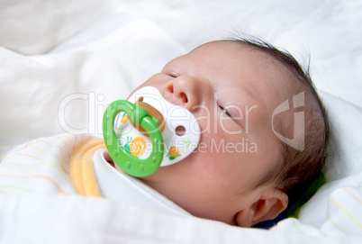 Newborn Baby With Pacifier Sleeping