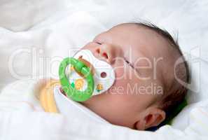 Newborn Baby With Pacifier Sleeping