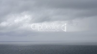 Ocean landscape with clouds and rain