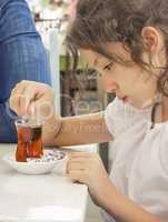 Little Girl Drinking Turkish Tea