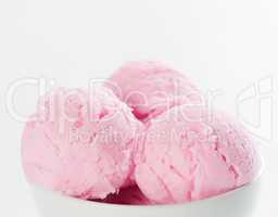 Pink ice cream in bowl with copy space on top