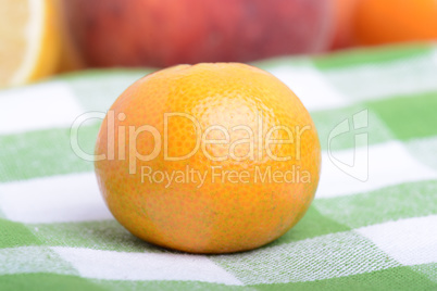 many different fruits for the health of the entire family, peach, mandarin, strawberry slices