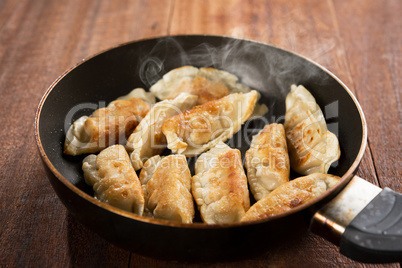 Fried dumpling in cooking pan