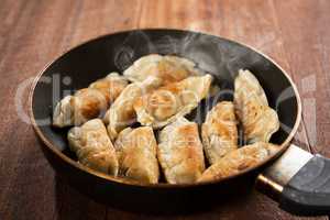 Fried dumpling in cooking pan