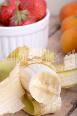 Fresh colorful fruits composition mandarin, bananas and orange