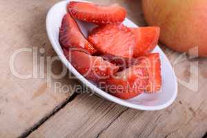 Strawberry slices and apple, closeup