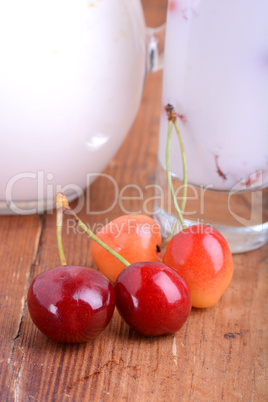 a delicious cherry milkshake on wooden plate