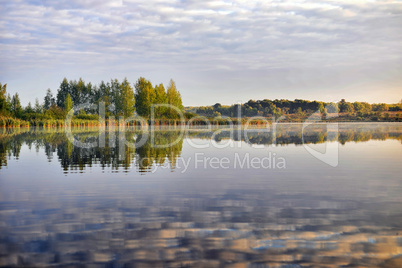 Water landscape with clouds reflection