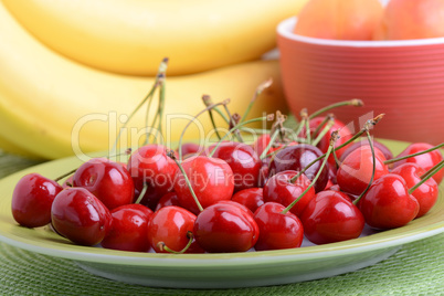 Composition with fruits cherry bananas apricot