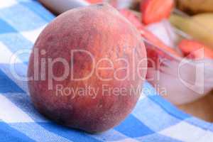 peach strawberry bananas mandarin close up as health food concept
