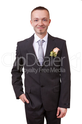 Groom holding hand in his pocket
