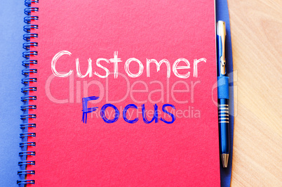 Customer focus write on notebook