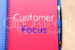 Customer focus write on notebook