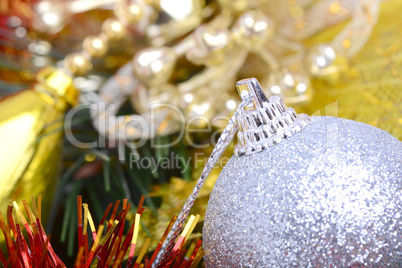 Closeup of Christmas balls and green fir tree branch, new year invitation card