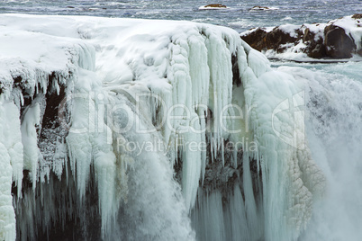 Closeup of frozen waterfall Godafoss, Iceland