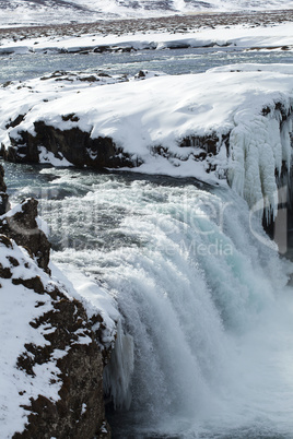 Closeup of frozen waterfall Godafoss, Iceland