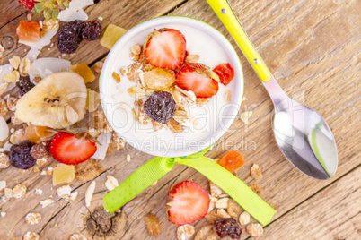 Yogurt with cereals muesli and fresh strawberries