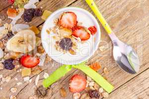 Yogurt with cereals muesli and fresh strawberries