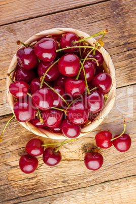 Fresh cherries on wood