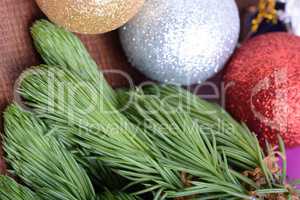 Closeup of beautiful Christmas baubles, Decorated christmas tree, holiday background, green tree eve branch close up with christmas balls