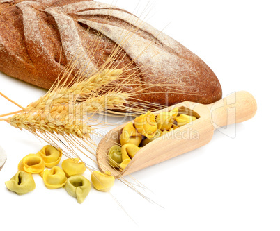 Bread and wheat ears isolated on white background