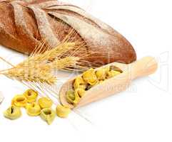Bread and wheat ears isolated on white background