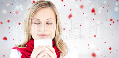 Composite image of portrait of a young woman enjoying her hot co