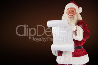 Composite image of father christmas holds a list