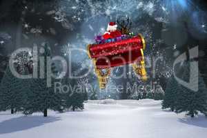 Composite image of santa flying his sleigh