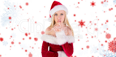 Composite image of festive blonde keeping a secret