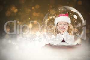 Composite image of festive child in snow globe